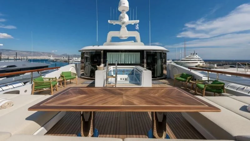 a deck with a boat and a building on it aboard AELIA Yacht for Sale