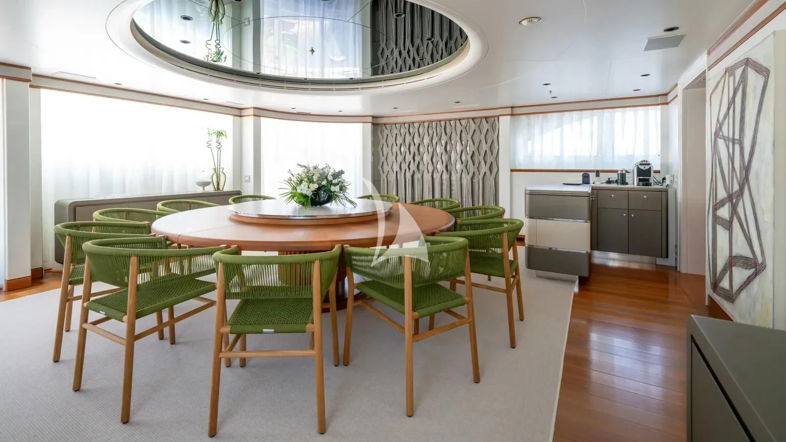 a room with a table and chairs aboard AELIA Yacht for Sale