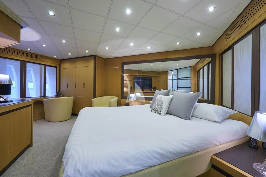 a large bed in a hotel room aboard DANZAS Yacht for Sale
