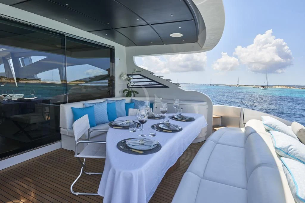 a table set for a meal on a boat aboard DANZAS Yacht for Sale