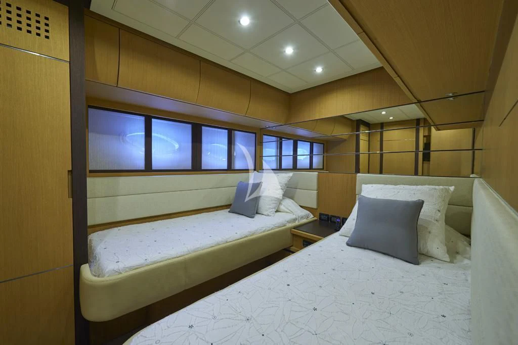 a room with two beds aboard DANZAS Yacht for Sale
