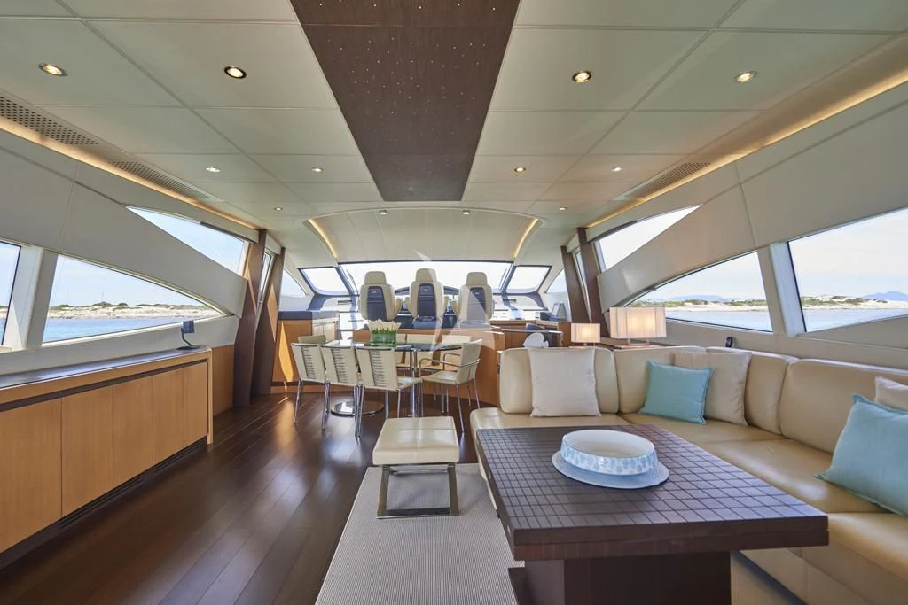 a boat with a table and chairs aboard DANZAS Yacht for Sale