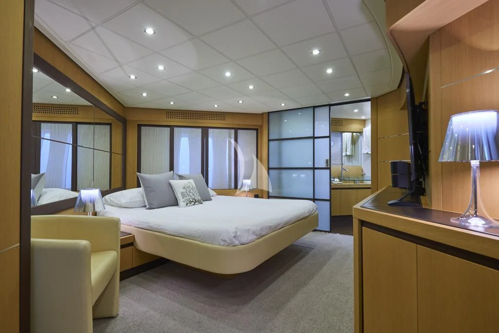 a large bedroom with a large bed aboard DANZAS Yacht for Sale