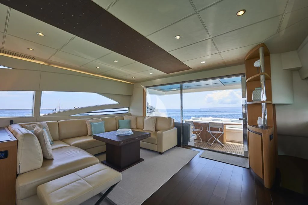 a living room with a large window aboard DANZAS Yacht for Sale