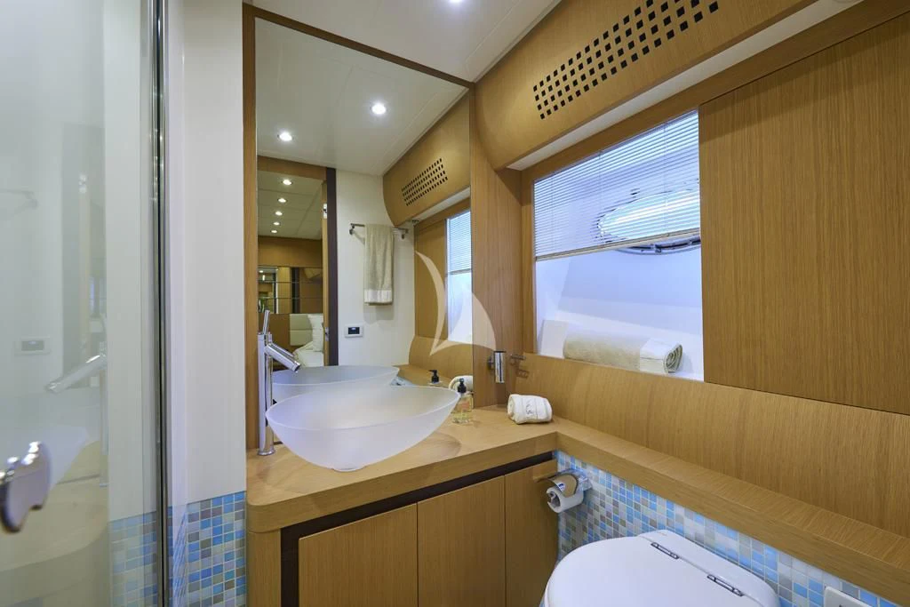 a bathroom with a sink and a mirror aboard DANZAS Yacht for Sale