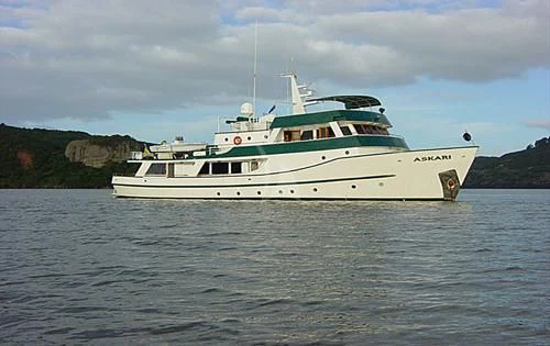a white boat in the water aboard ASKARI Yacht for Sale