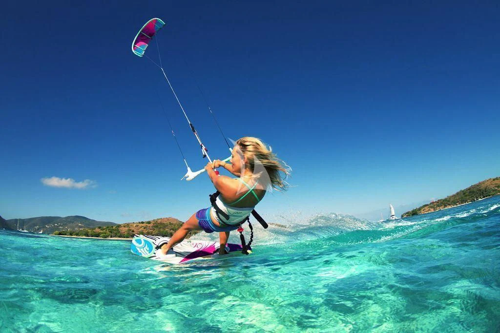 a man kite surfing in the sea aboard ASKARI Yacht for Sale