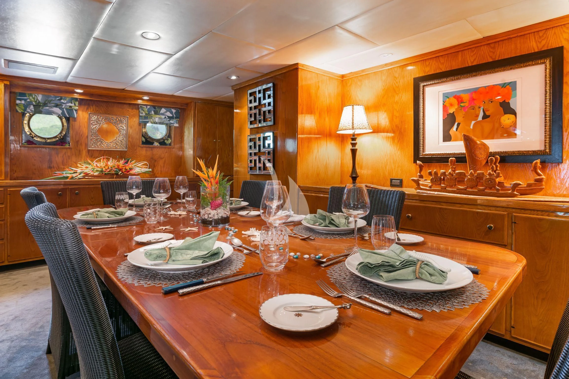 a large dining table with plates and glasses on it aboard ASKARI Yacht for Sale