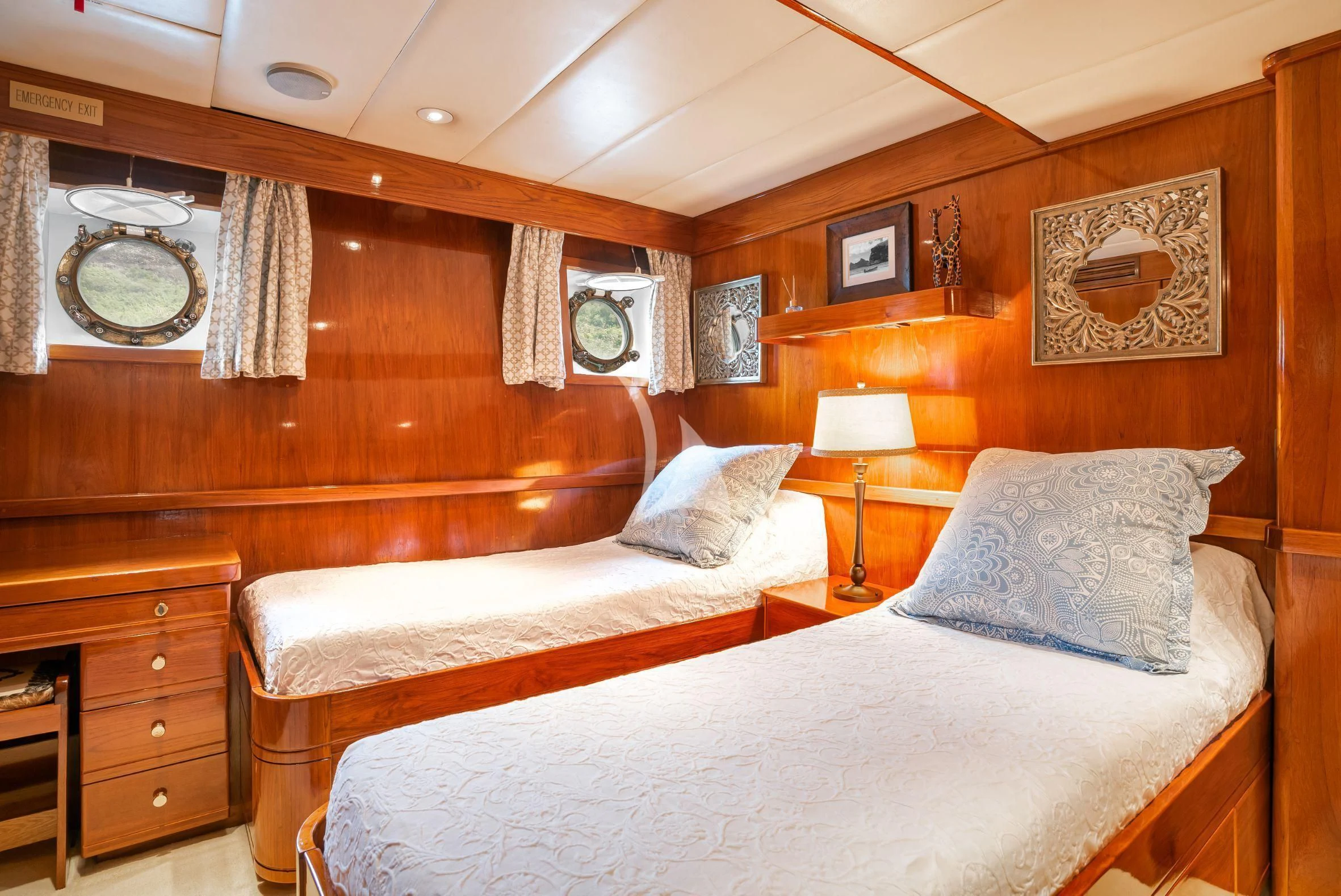 a room with two beds aboard ASKARI Yacht for Sale
