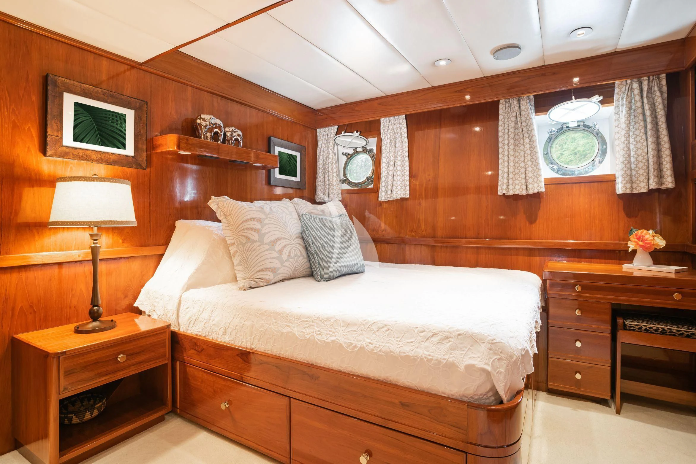 a bed in a room aboard ASKARI Yacht for Sale