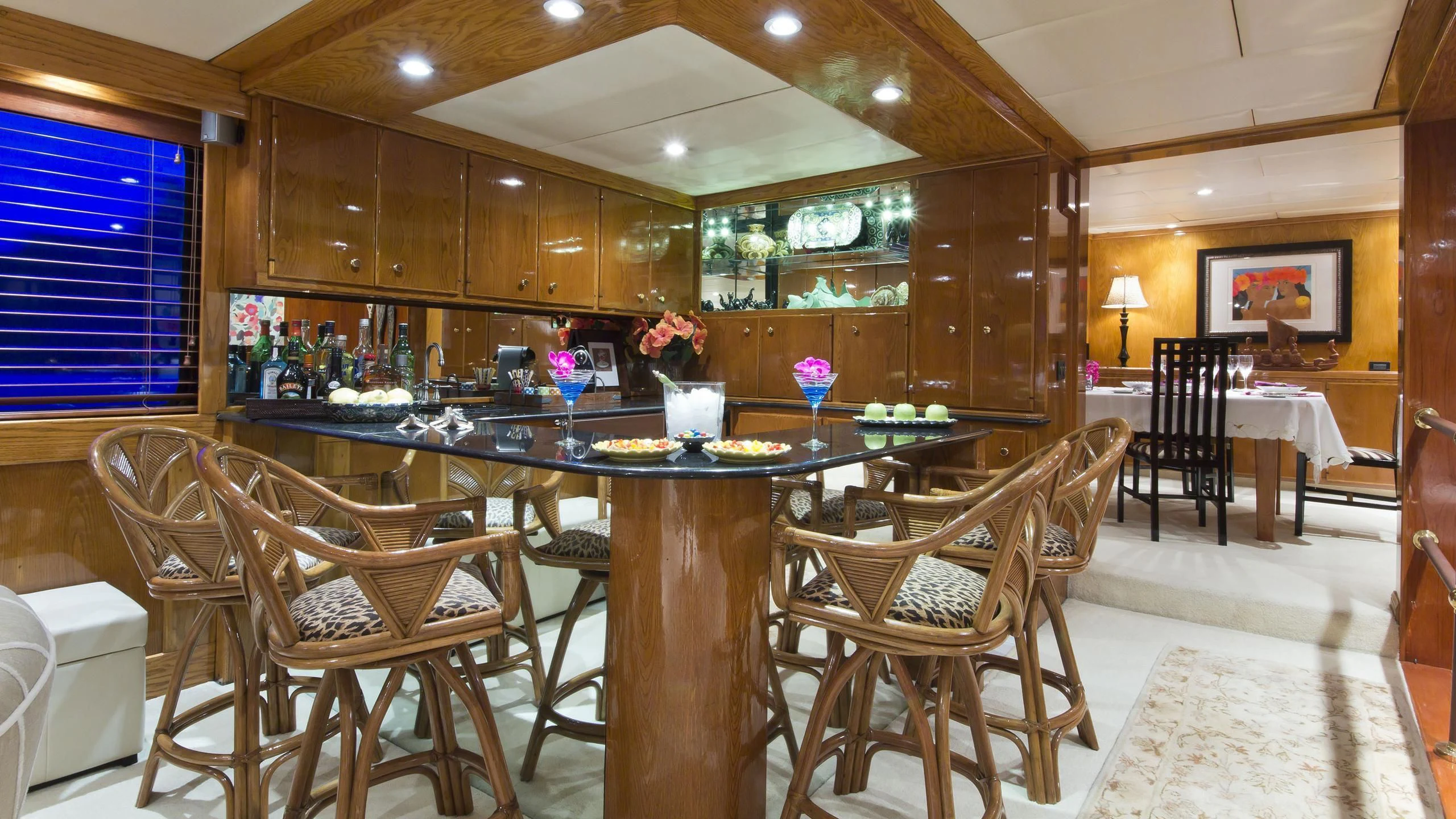 a large room with a table and chairs aboard ASKARI Yacht for Sale