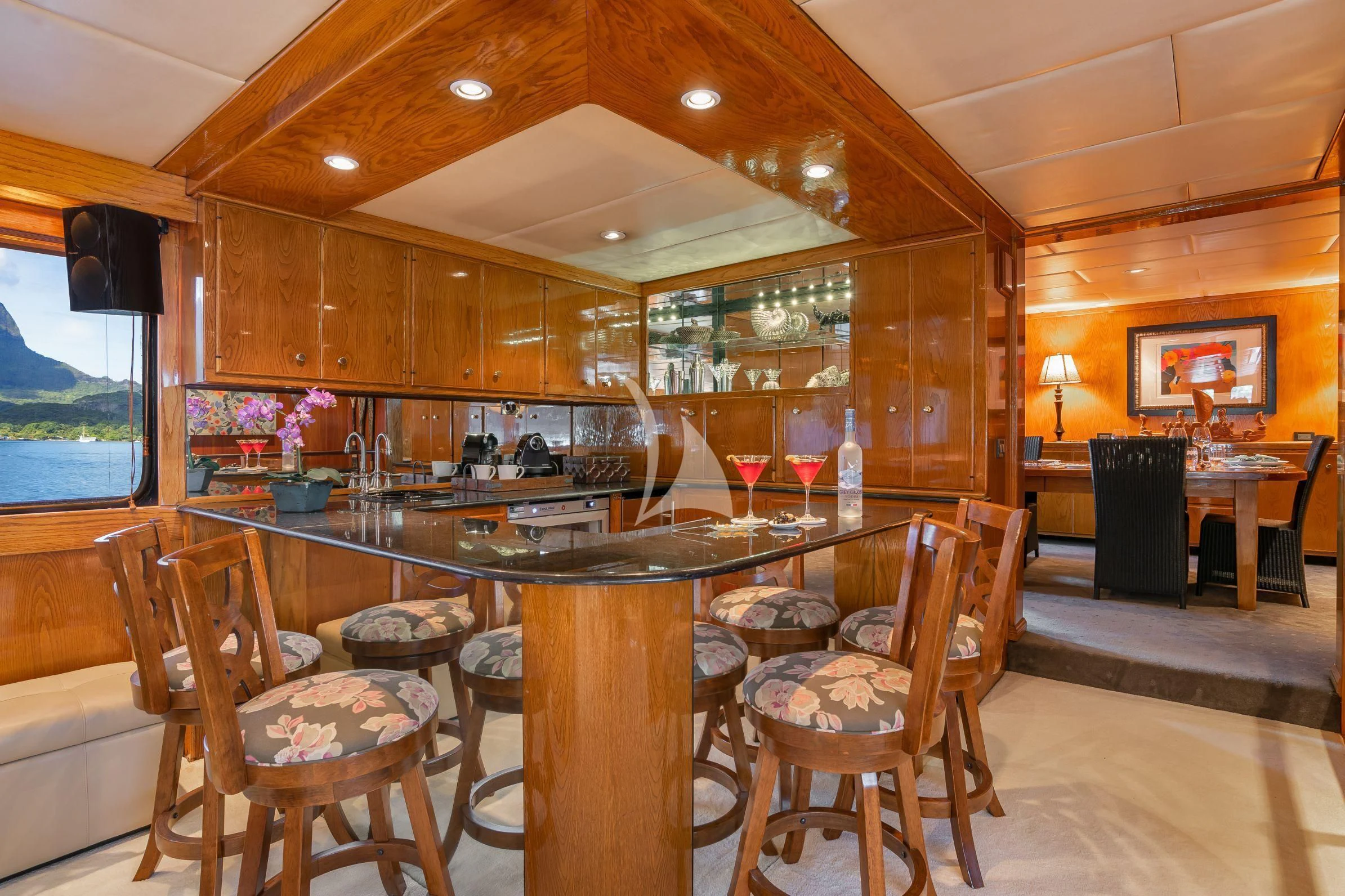 a large kitchen with a bar aboard ASKARI Yacht for Sale