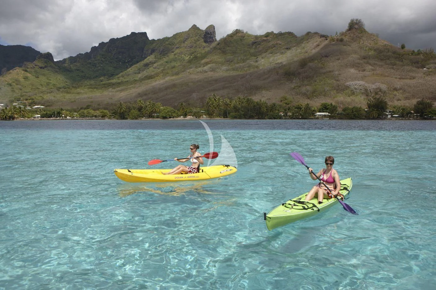 a group of people in a canoe on a lake aboard ASKARI Yacht for Sale