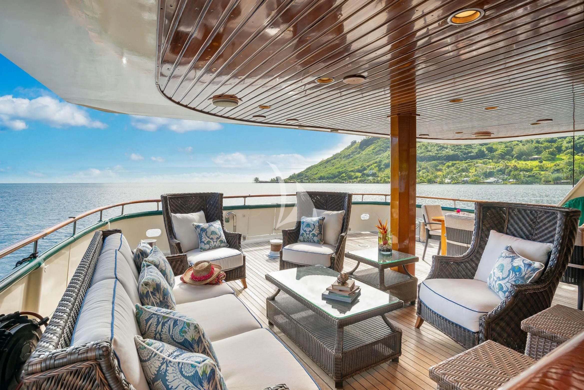 a large patio with a large deck and a view of the ocean aboard ASKARI Yacht for Sale
