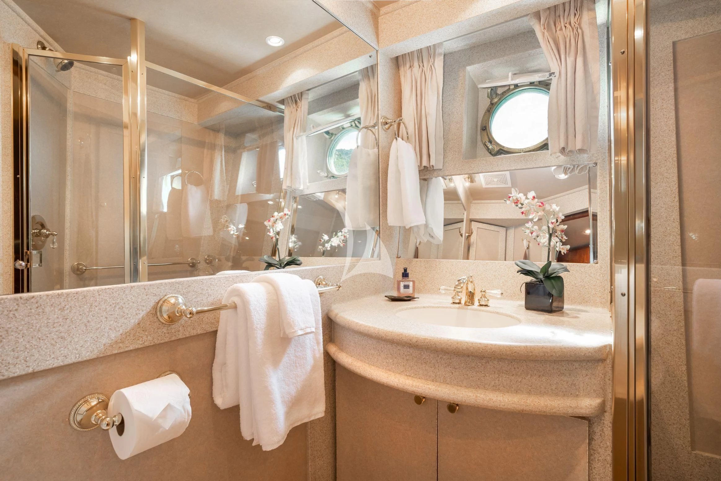 a bathroom with a large mirror aboard ASKARI Yacht for Sale
