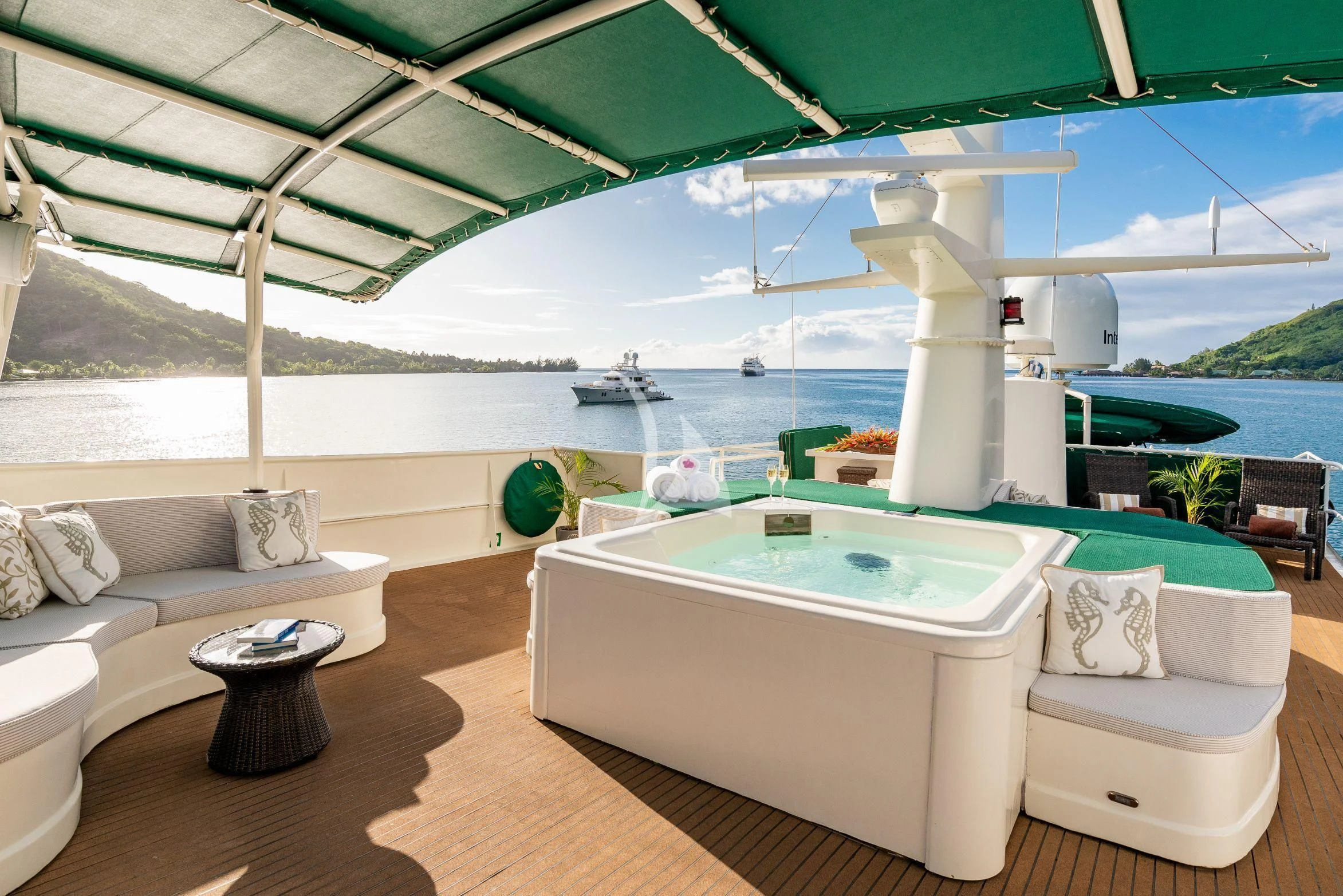 a large white lounge chair next to a pool aboard ASKARI Yacht for Sale