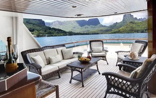 a patio with a table and chairs aboard ASKARI Yacht for Sale
