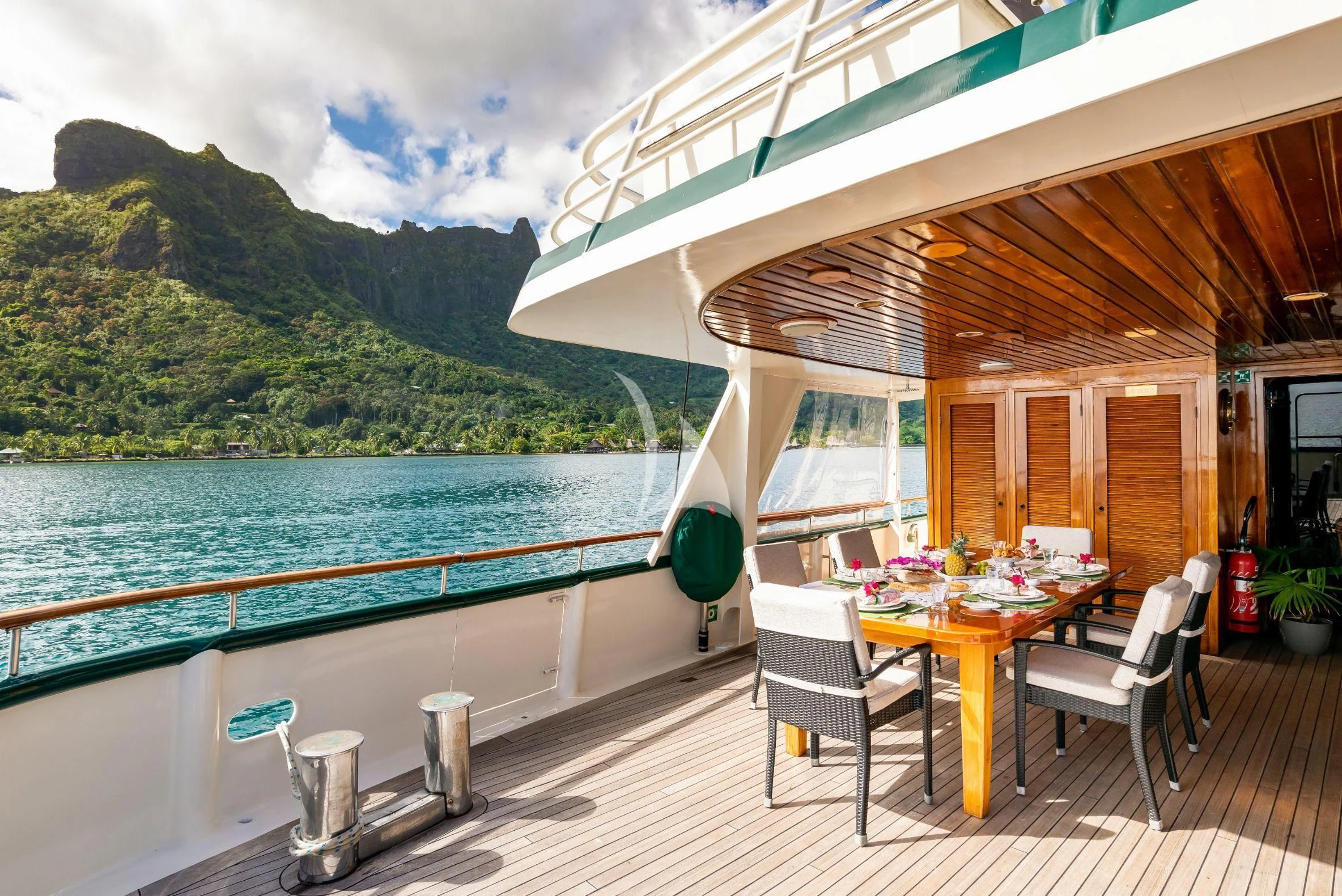 a patio with a table and chairs aboard ASKARI Yacht for Sale