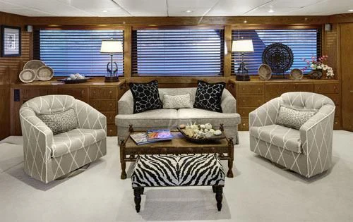 a living room with a couch and a coffee table aboard ASKARI Yacht for Sale