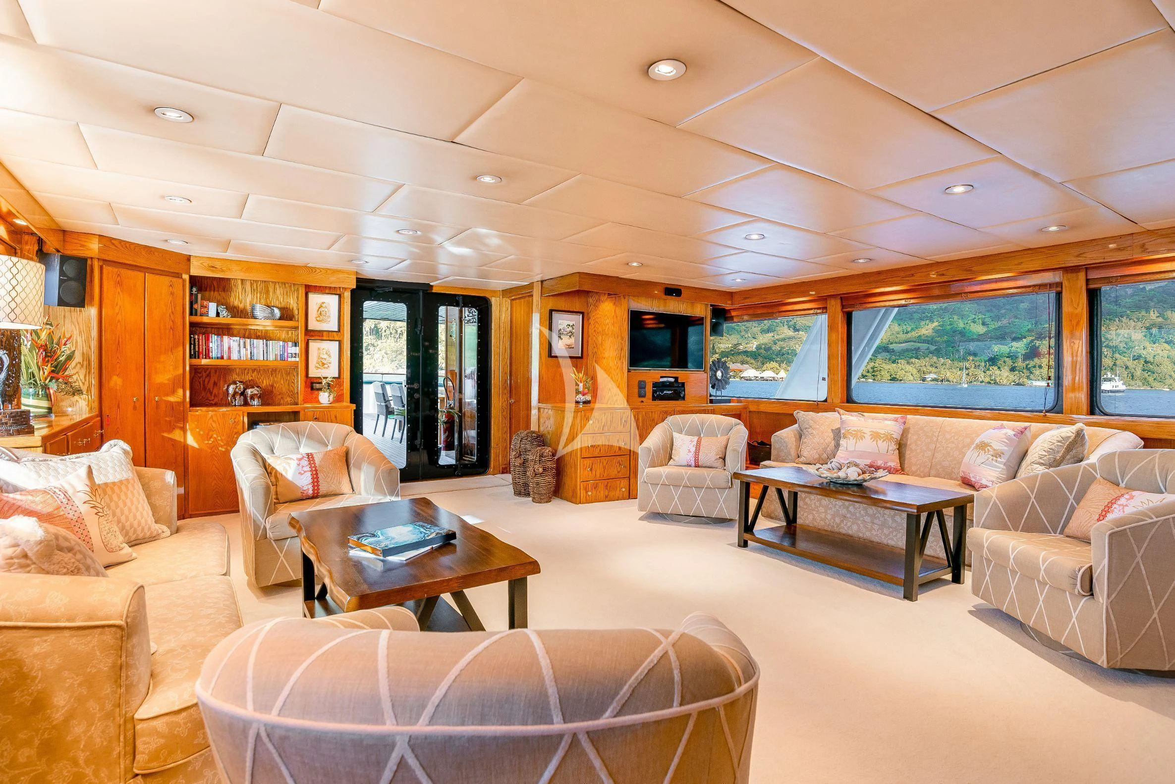 a living room with a large window aboard ASKARI Yacht for Sale