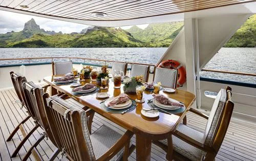 a table set for a meal on a boat aboard ASKARI Yacht for Sale