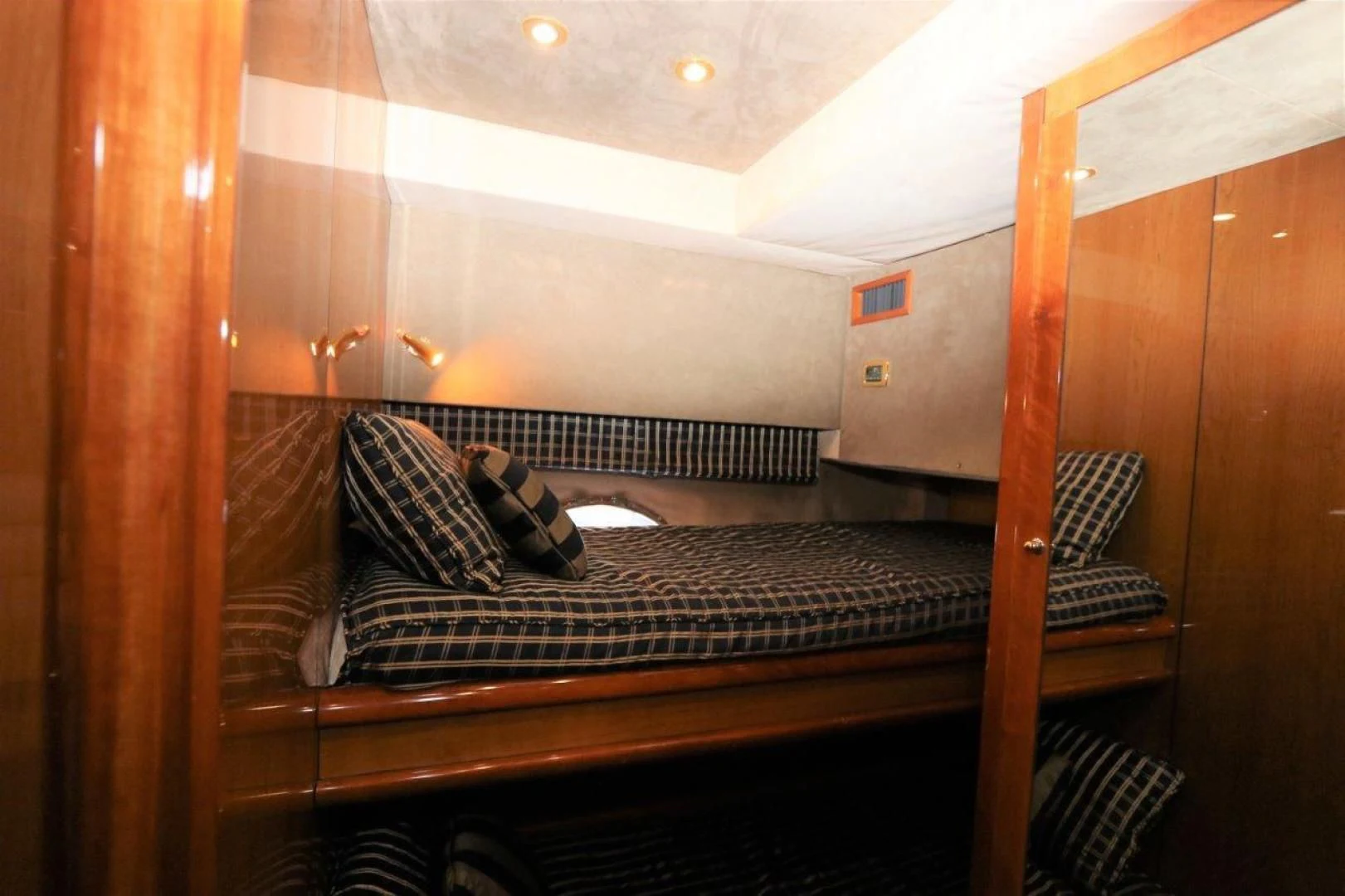 a bed in a room aboard SECOND THOUGHTS Yacht for Sale