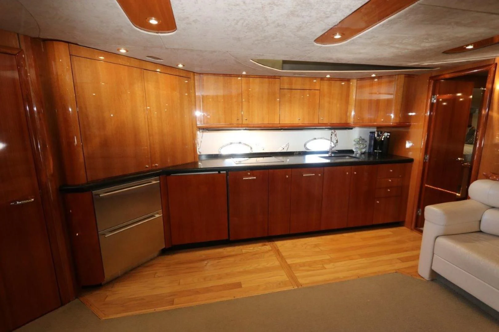 a kitchen with wooden cabinets aboard SECOND THOUGHTS Yacht for Sale