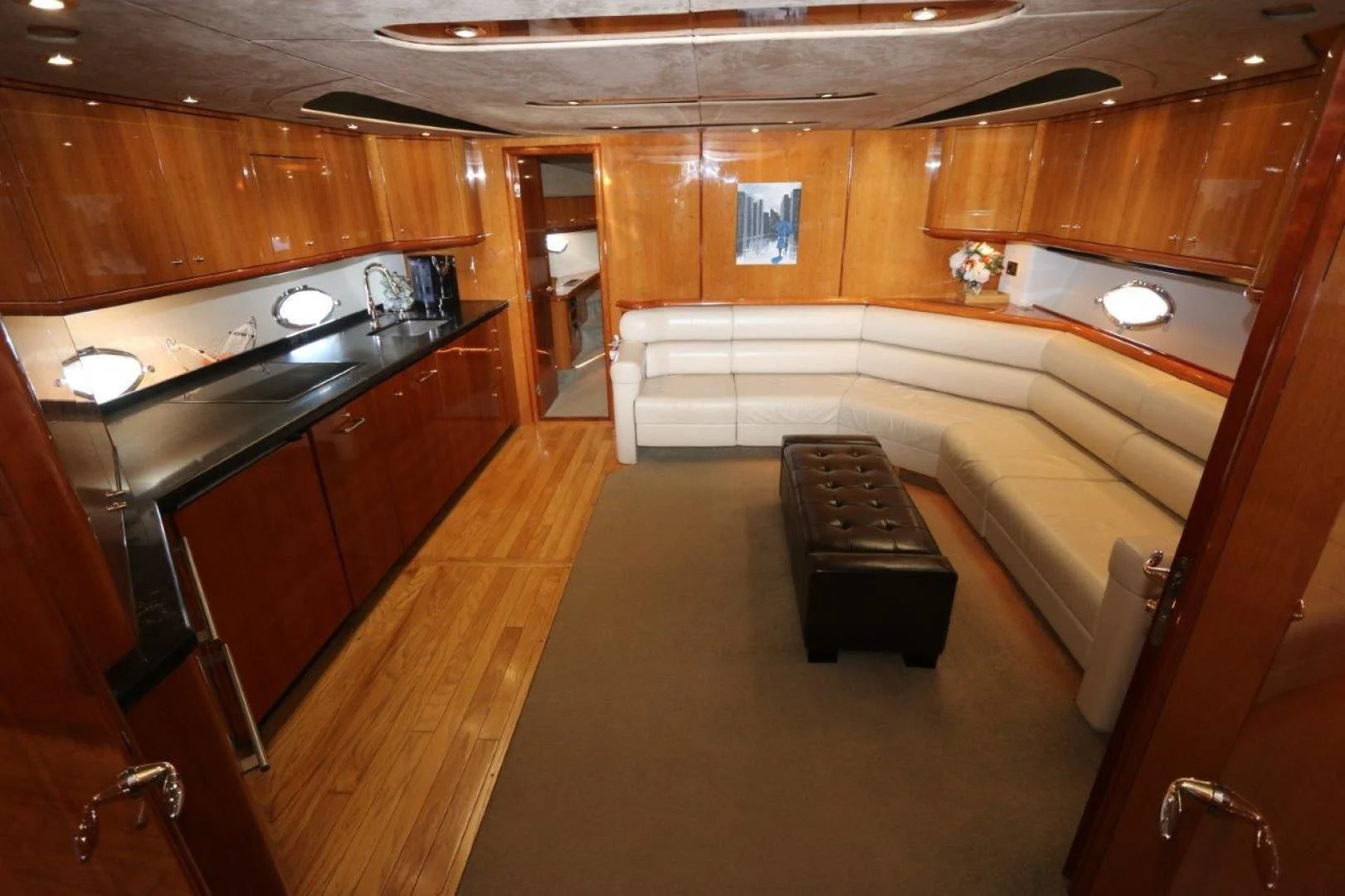 a large kitchen with wooden cabinets aboard SECOND THOUGHTS Yacht for Sale