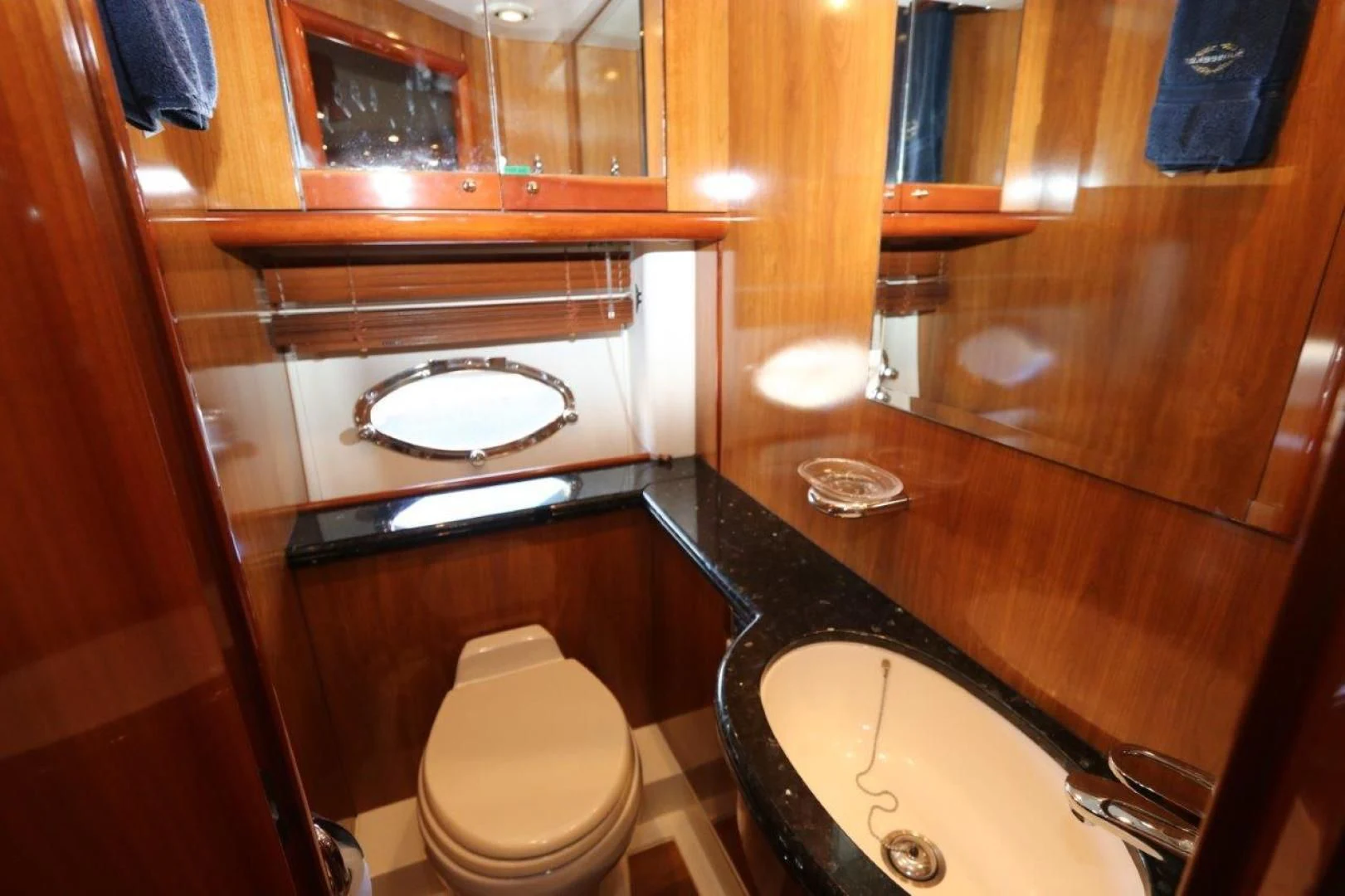 a bathroom with a sink and toilet aboard SECOND THOUGHTS Yacht for Sale