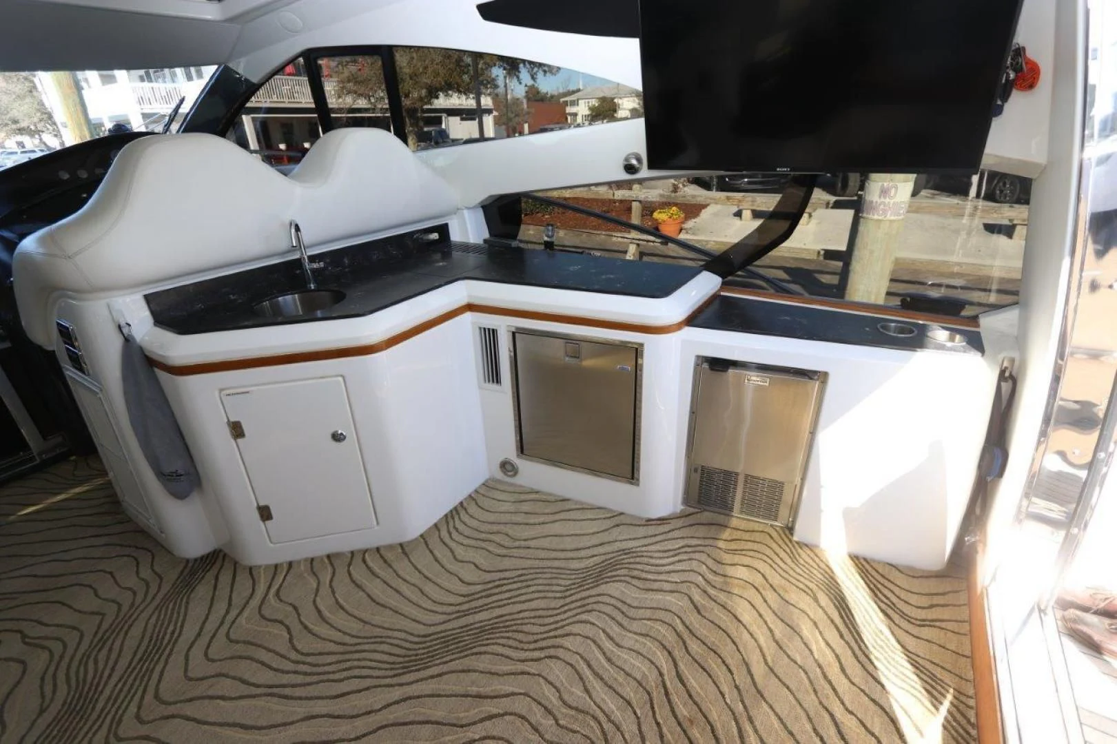 a car with a large hood aboard SECOND THOUGHTS Yacht for Sale