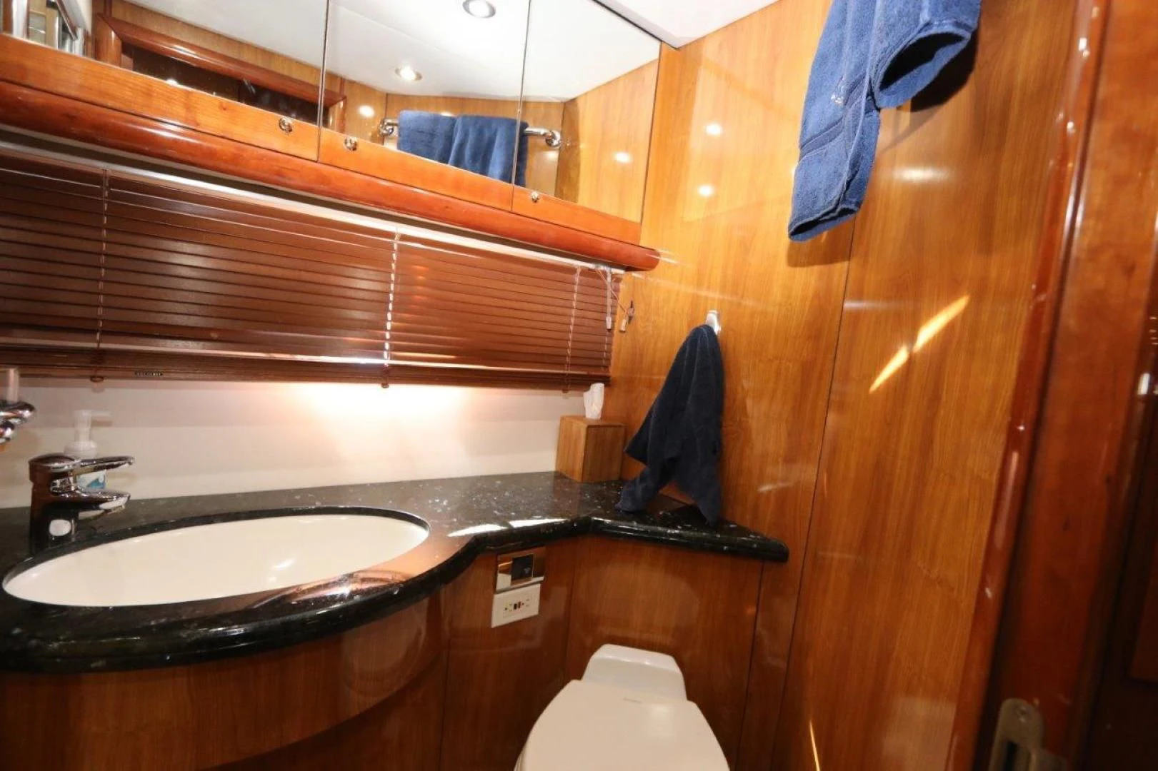 a bathroom with a sink and a toilet aboard SECOND THOUGHTS Yacht for Sale