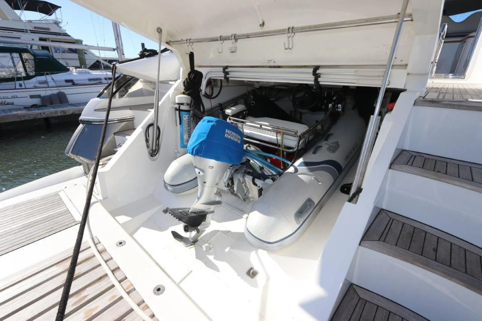 a boat with a blue and white sail aboard SECOND THOUGHTS Yacht for Sale