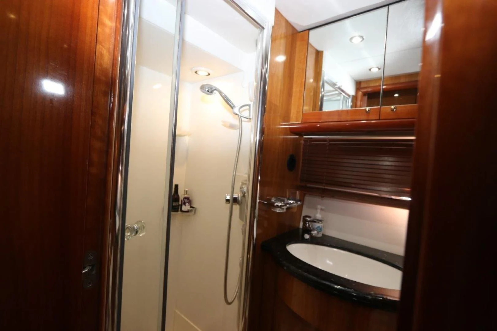 a bathroom with a glass shower aboard SECOND THOUGHTS Yacht for Sale