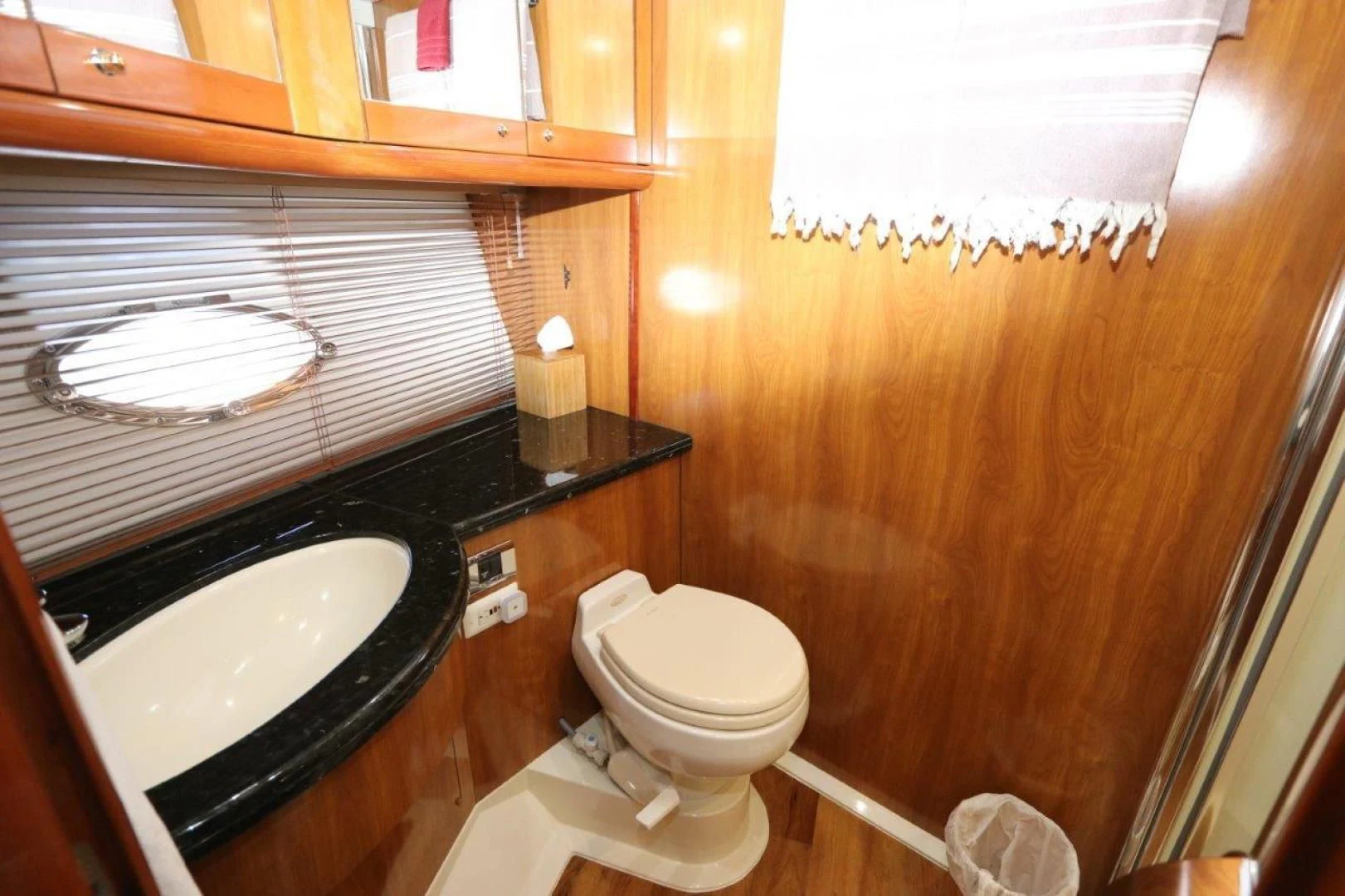a bathroom with a sink and toilet aboard SECOND THOUGHTS Yacht for Sale