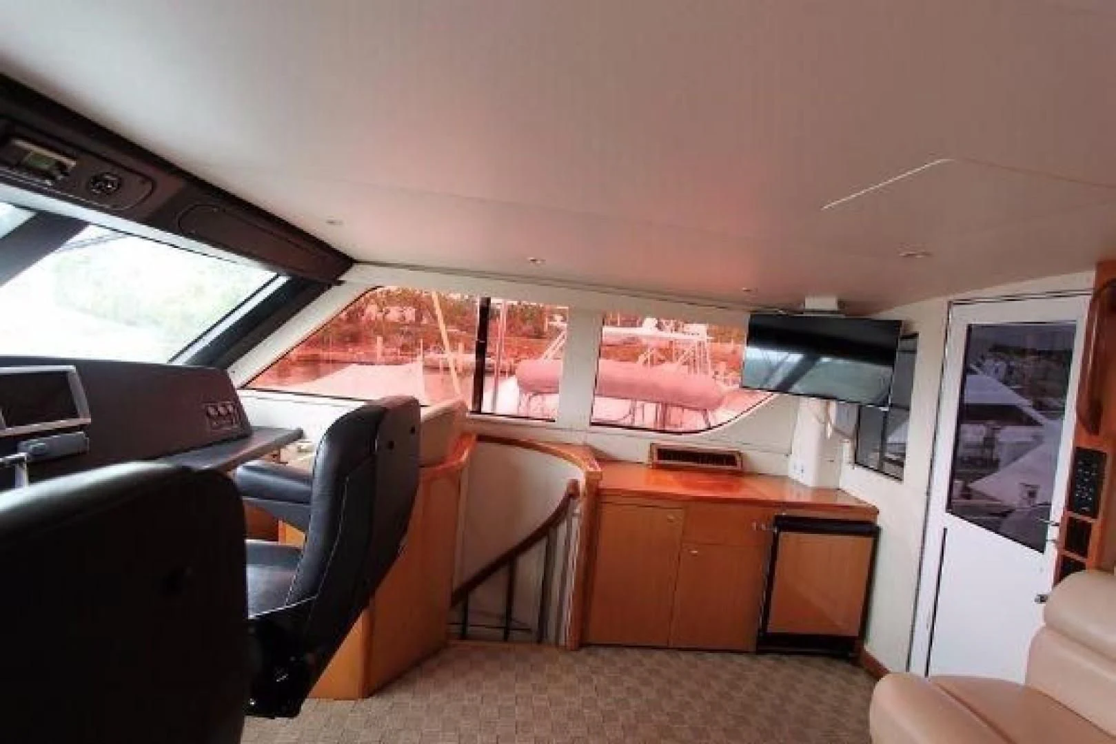 inside of a vehicle with a desk and chairs aboard BROKYSTONE Yacht for Sale