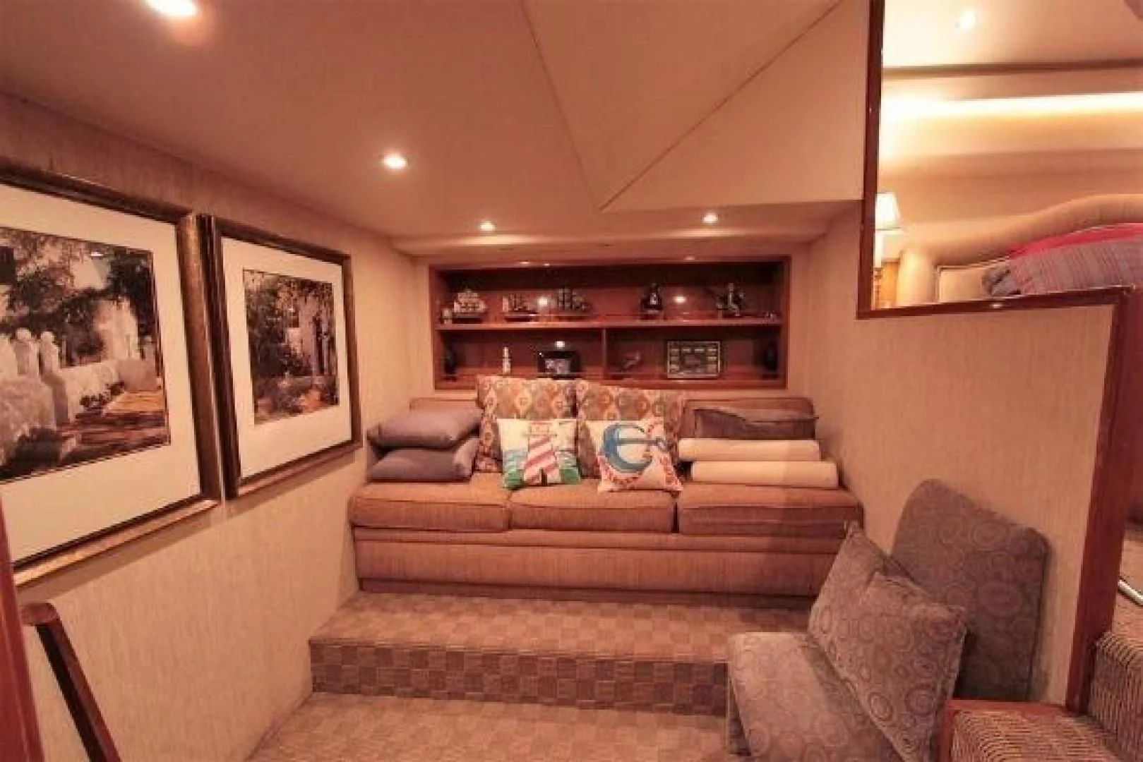 a living room with a couch and a fireplace aboard BROKYSTONE Yacht for Sale