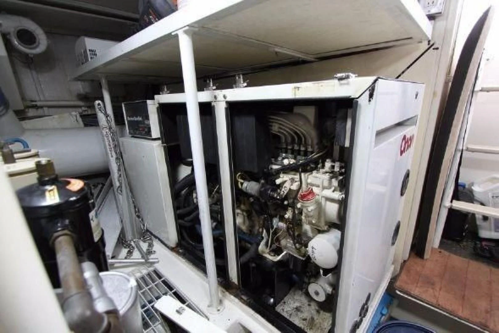 a large machine with a large metal cylinder aboard BROKYSTONE Yacht for Sale