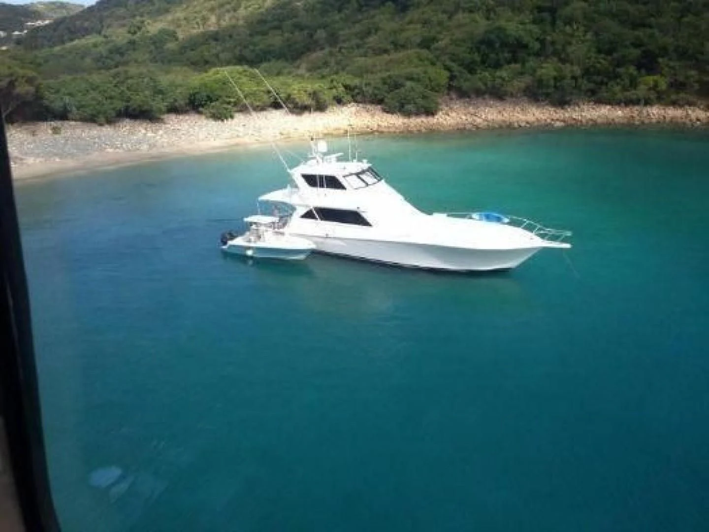 a white boat on water aboard BROKYSTONE Yacht for Sale