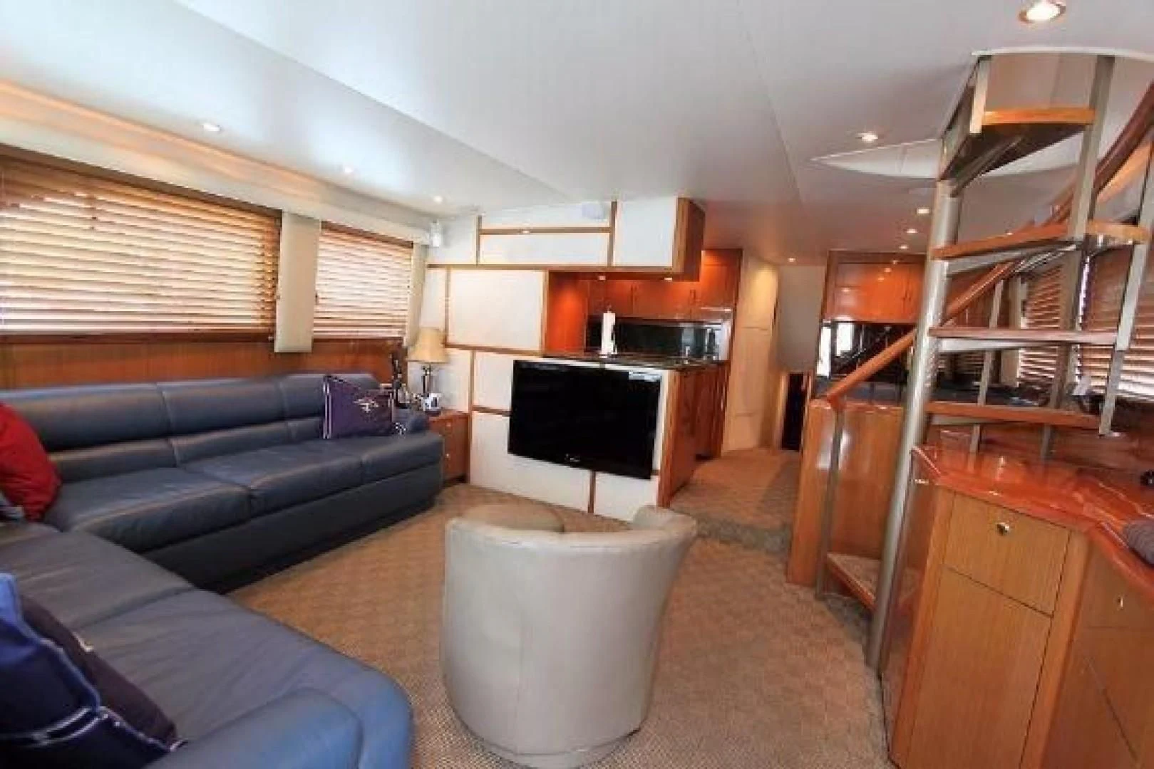 a living room with a fireplace aboard BROKYSTONE Yacht for Sale