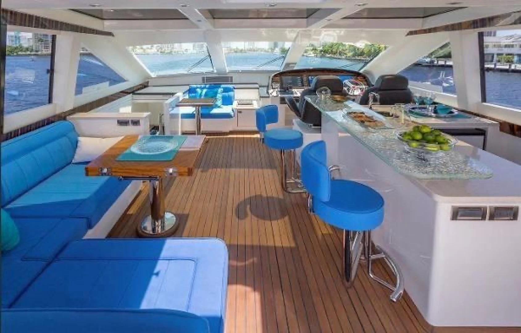 a room with tables and chairs aboard FUJIMO Yacht for Sale