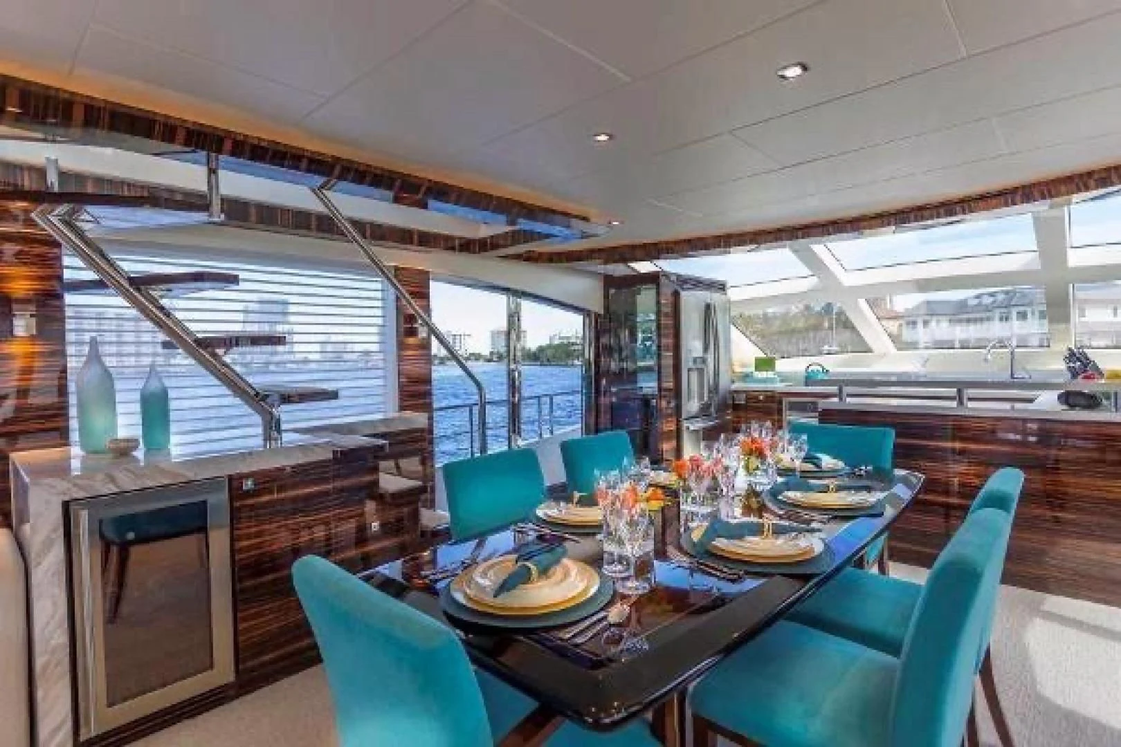 a large room with a table and chairs aboard FUJIMO Yacht for Sale