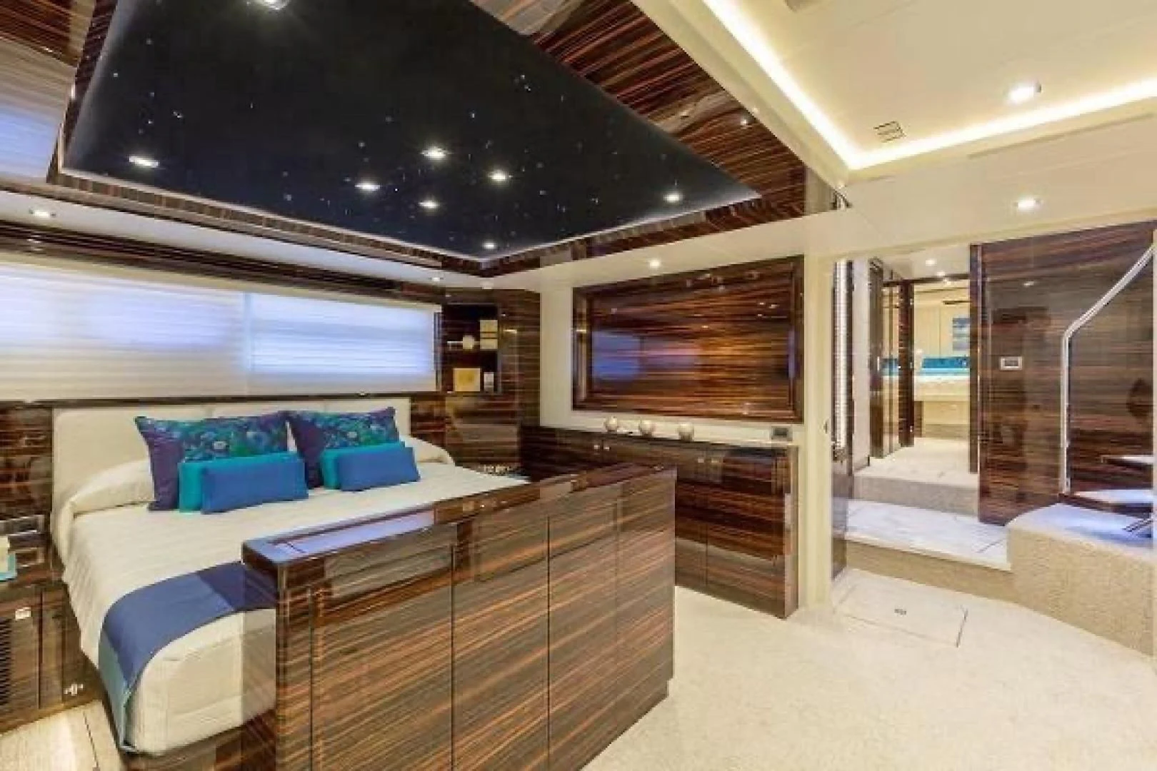 a room with a bed and a large window aboard FUJIMO Yacht for Sale
