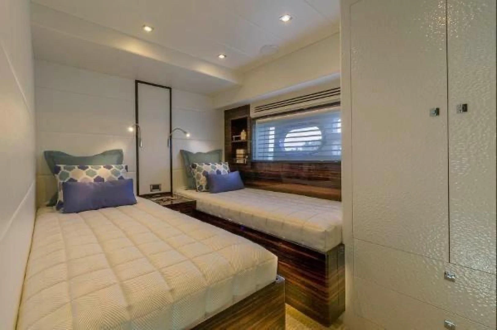 a bedroom with two beds aboard FUJIMO Yacht for Sale