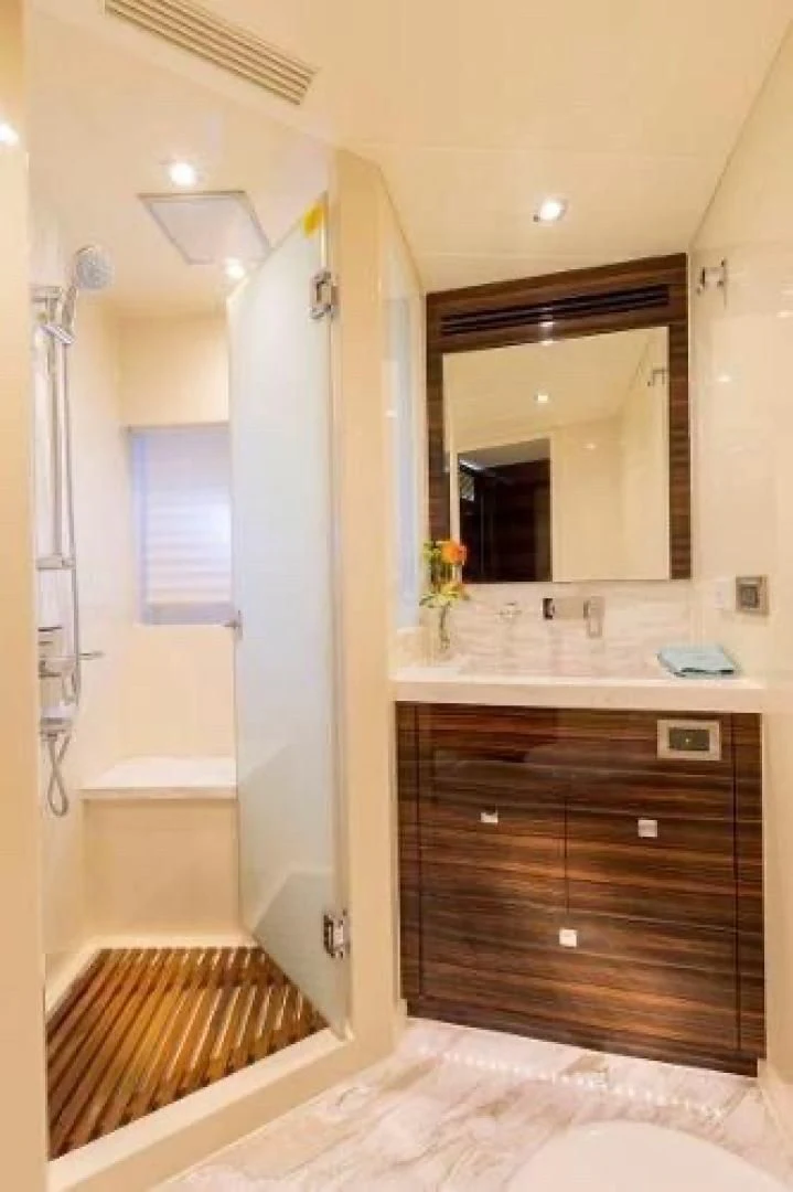 a bathroom with a large mirror aboard FUJIMO Yacht for Sale