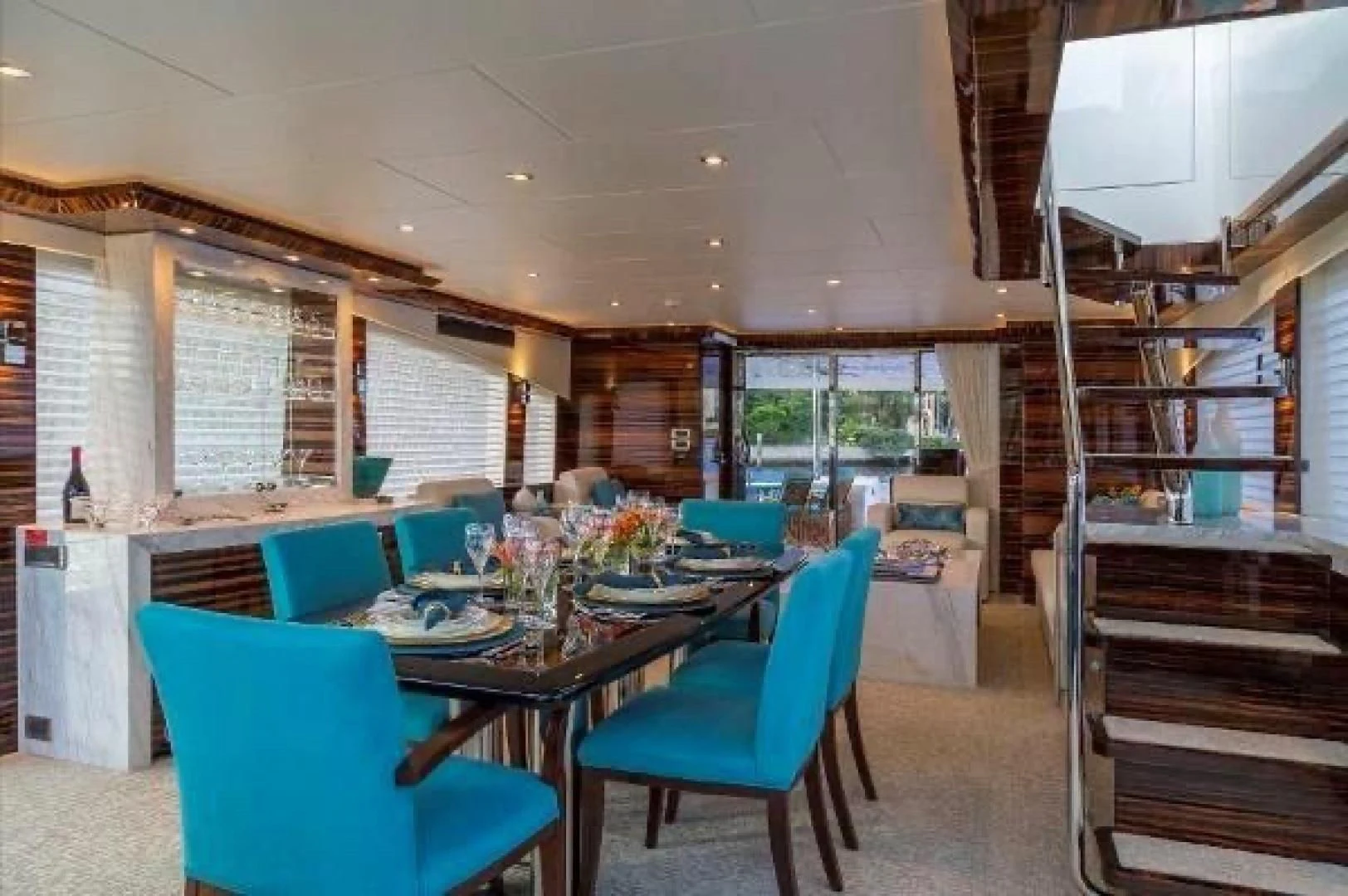 a room with a table and chairs aboard FUJIMO Yacht for Sale