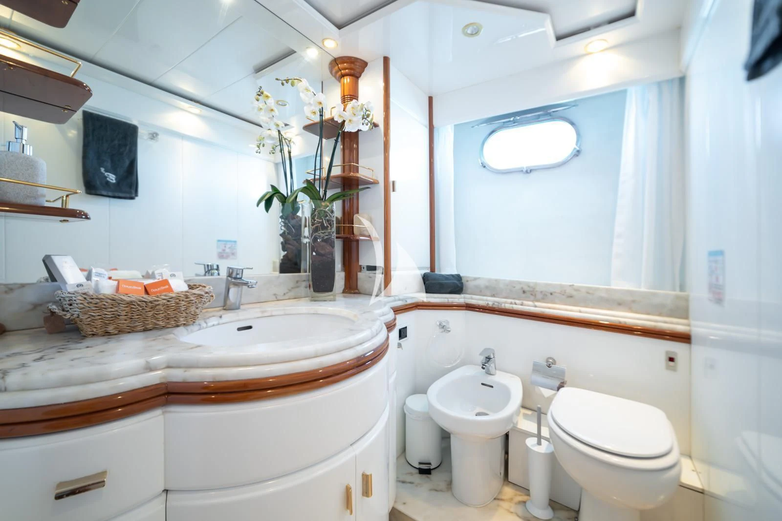 a bathroom with a sink toilet and a mirror aboard IRMAO Yacht for Sale