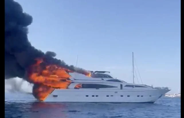 a boat with a flame coming out of it aboard IRMAO Yacht for Sale