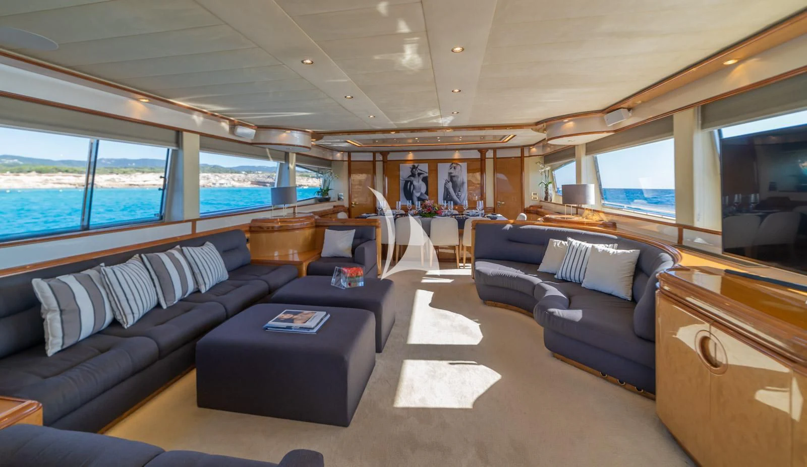 a living room with a couch and a table aboard IRMAO Yacht for Sale