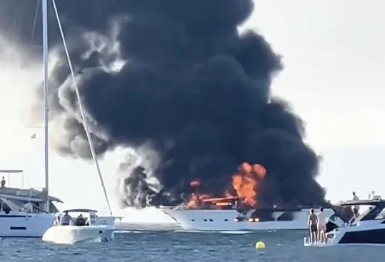 a large black cloud over a boat aboard IRMAO Yacht for Sale