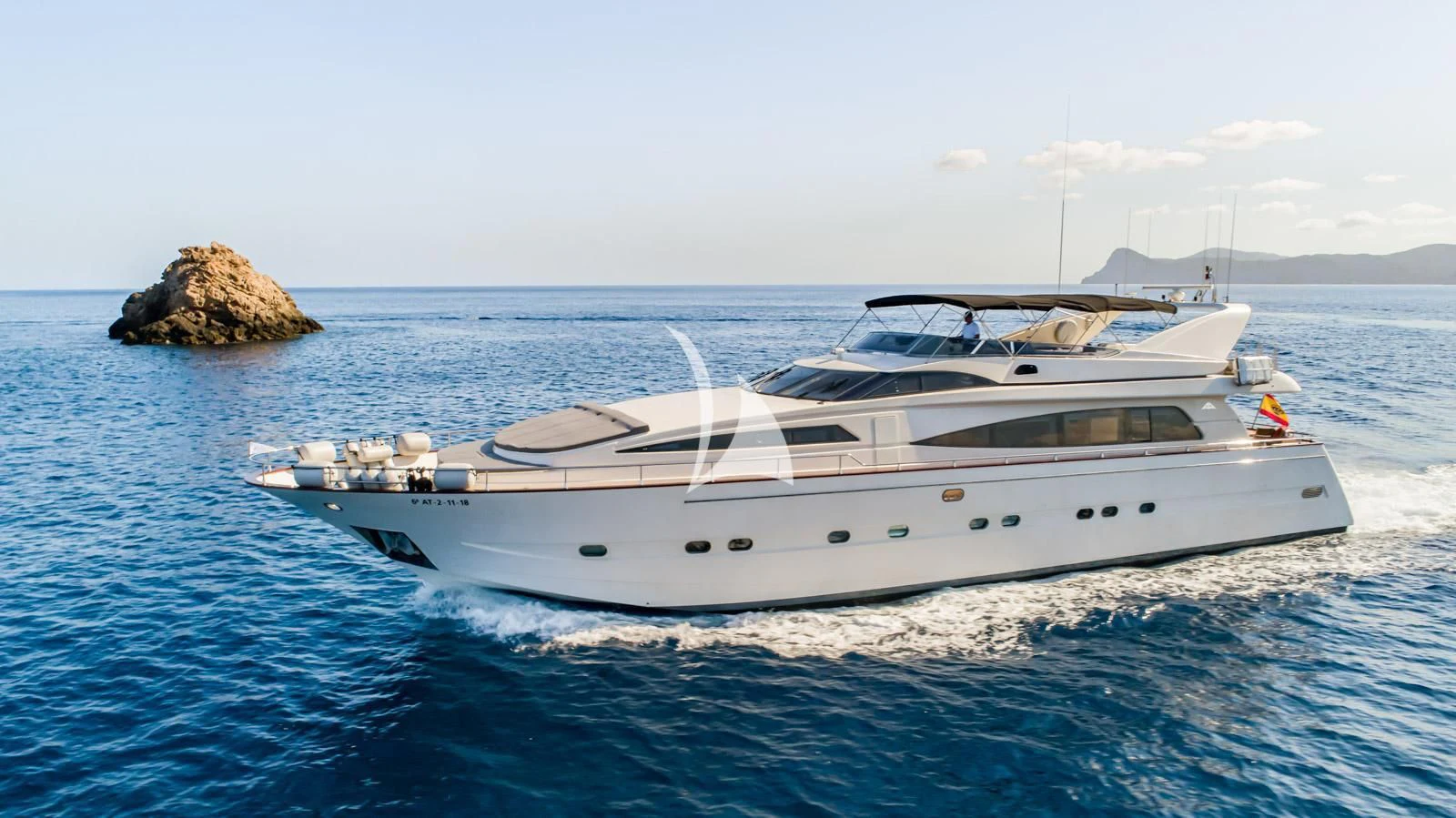 a white yacht in the water aboard IRMAO Yacht for Sale